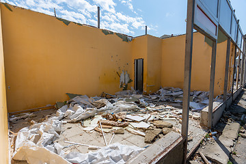 Image showing Dismantling of an illegally built store, the rest of the walls, construction waste
