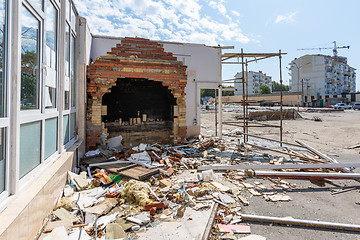 Image showing Dismantling pavilions in the market, a half-disassembled furnace of a former cafe