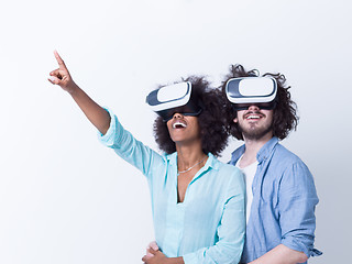 Image showing multiethnic couple getting experience using VR headset glasses