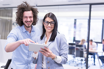 Image showing Business People Working With Tablet in startup office