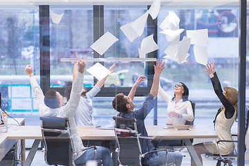 Image showing startup Group of young business people throwing documents