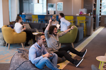 Image showing startup Office Workers Playing computer games