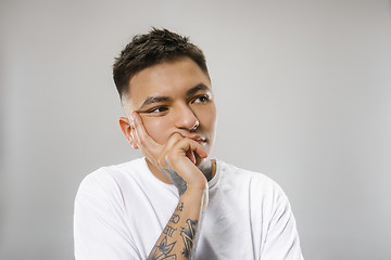 Image showing Beautiful bored man bored isolated on gray background