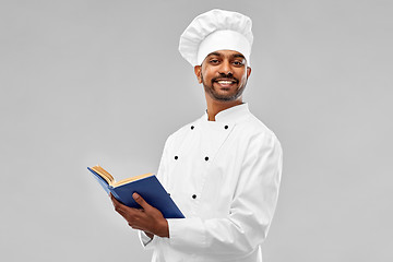 Image showing happy male indian chef with cookbook