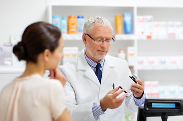 Image showing apothecary with cure and customer at pharmacy