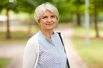 Image showing portrait of happy senior woman at summer park