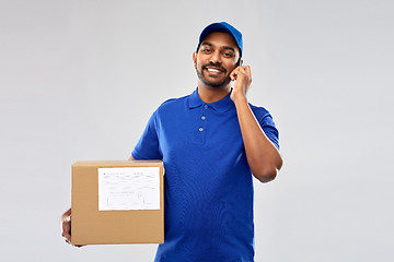 Image showing indian delivery man with smartphone and parcel box