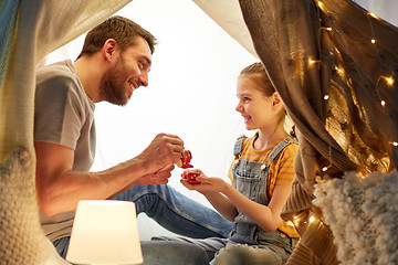 Image showing family playing tea party in kids tent at home