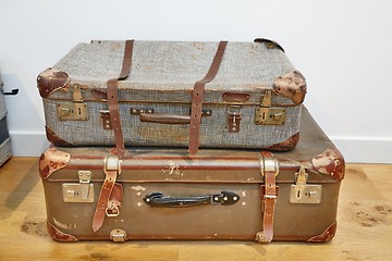 Image showing Vintage suitcases on the floor