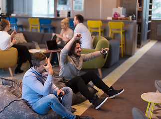 Image showing startup Office Workers Playing computer games