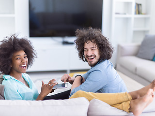 Image showing multiethnic couple in living room