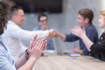 Image showing cloasing the deal in modern office interior