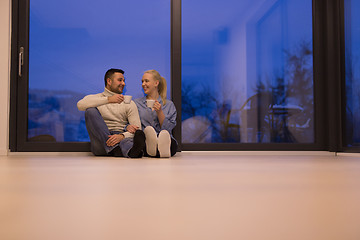 Image showing happy couple in front of fireplace