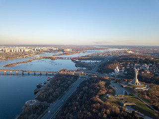 Image showing Beautiful urban landscape on the left, right banks of the Dnieper, Kiev, Ukraine, modern architecture against the blue sky on a sunny spring day