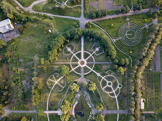 Image showing Regular and landscape planning of the garden with alleys, flowerbeds, labyrinth and squares. The aerial view from the drone is strictly from above.