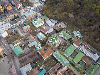 Image showing The panoramic bird\'s eye view from drone to the central historical part of the city Kiev Ukraine - the Podol district at summer sunset.