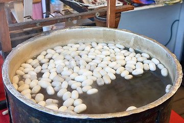 Image showing Boiling silkworm cocoon in a pan with water. A process of making silk cloth in Istanbul