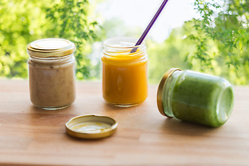 Image showing vegetable or fruit puree or baby food in jars