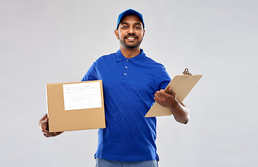 Image showing indian delivery man with parcel box and clipboard