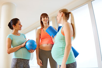 Image showing pregnant women with sports equipment in gym