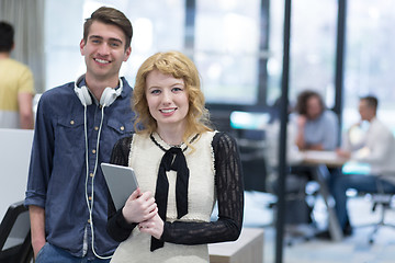 Image showing Business People Working With Tablet in startup office