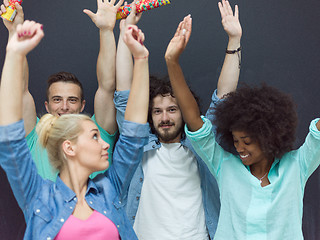 Image showing confetti party multiethnic group of people isolated over gray