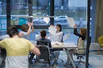 Image showing startup Group of young business people throwing documents