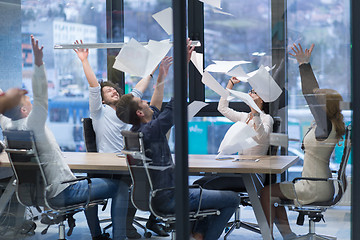 Image showing startup Group of young business people throwing documents