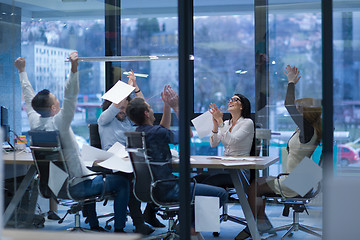 Image showing startup Group of young business people throwing documents