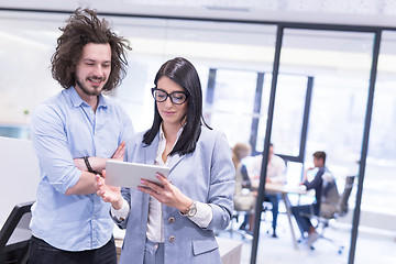 Image showing Business People Working With Tablet in startup office