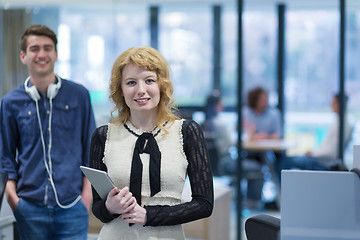 Image showing Business People Working With Tablet in startup office