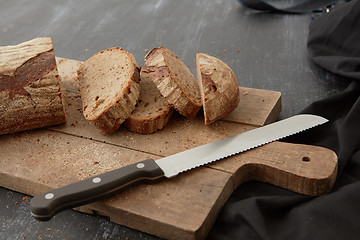 Image showing Fresh bread on wooden board