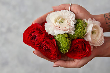 Image showing girl holding a bouquet of flowers