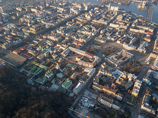 Image showing The panoramic bird\'s eye view from drone to the central historical part of the city Kiev - the Podol district, the Dnieper River in Kiev, Ukraine at summer sunset.