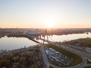 Image showing North Bridge with a large parking for cars over the Dnieper River and a view of the Skaimol shopping center in the Obolon area