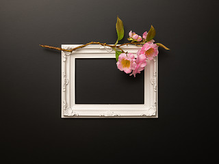 Image showing white frame on black background with cherry blossoms