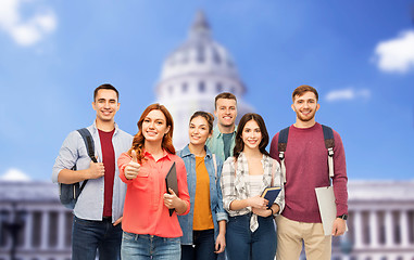 Image showing students showing thumbs up over capitol building