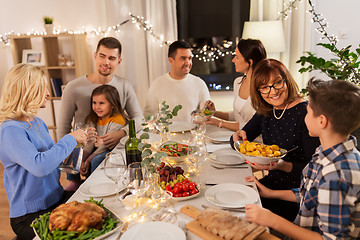 Image showing happy family having dinner party at home