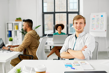 Image showing male creative worker with laptop at office