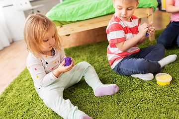 Image showing children with modelling clay or slimes at home