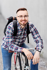 Image showing hipster man with fixed gear bike and backpack