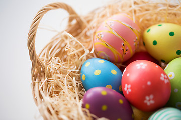 Image showing close up of colored easter eggs in basket