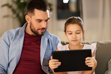 Image showing father and daughter with tablet computer at home