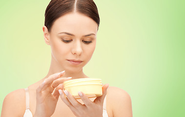 Image showing beautiful woman with moisturizing cream