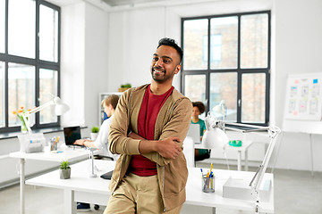 Image showing smiling indian man at office