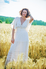 Image showing smiling beautiful middle aged woman in the field