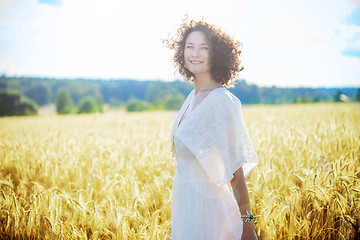 Image showing beautiful smiling woman in a white dress