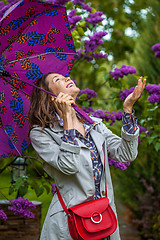 Image showing beautiful middle-aged woman with an umbrella