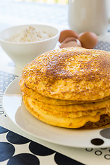 Image showing Stack of pancakes with baking ingredients