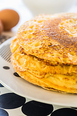 Image showing Stack of pancakes with baking ingredients